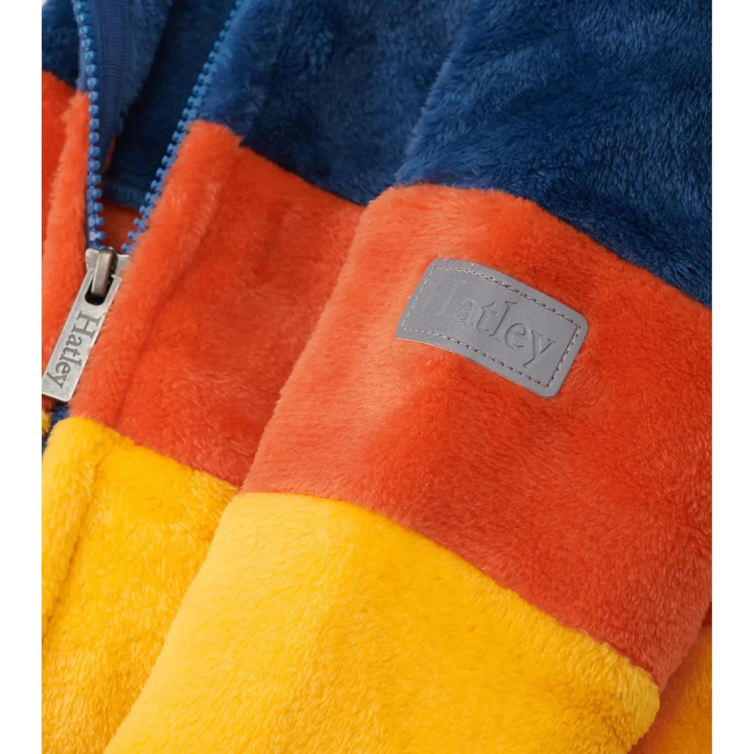 Hatley Kid's Colour Block Fuzzy Fleece Zip-Up Jacket shown in the Ensign Blue/Yellow color option. Patch view.