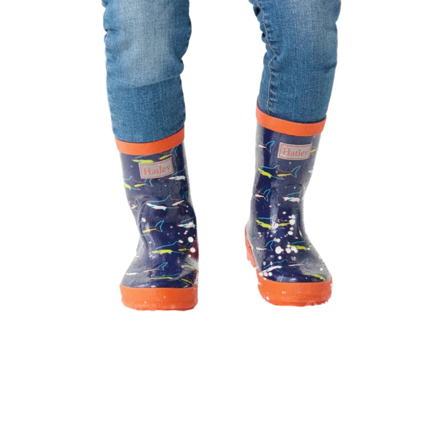 Hatley Kid's Rain Boots shown in the Shiny Sharks color option. Shown on model, front view.