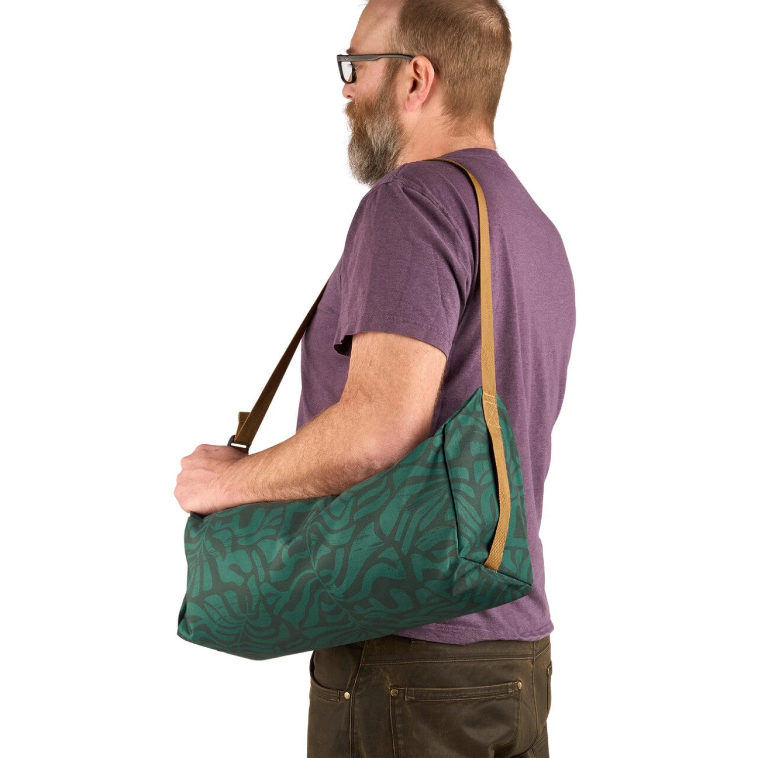 Kelty Lowdown Cot in Fern, view of cot packed into bag and bag on models shoulder 