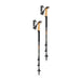 Two black and yellow hiking poles on a white background