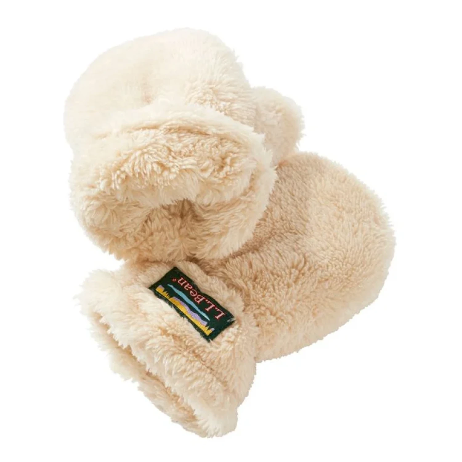 Pair of fluffy cream mittens with a brand label on a white background