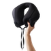 Matador Blackout Travel Pillow in Black, view of pillow being held 