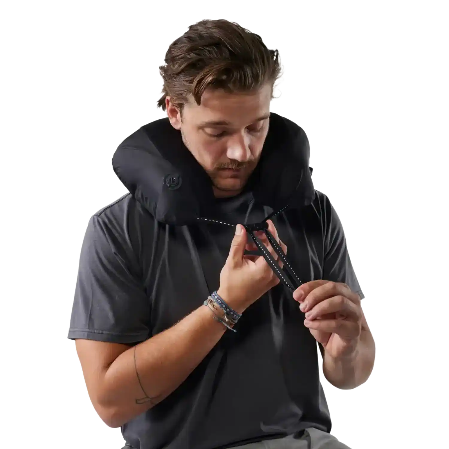 Matador Blackout Travel Pillow in Black, view of pillow on model 