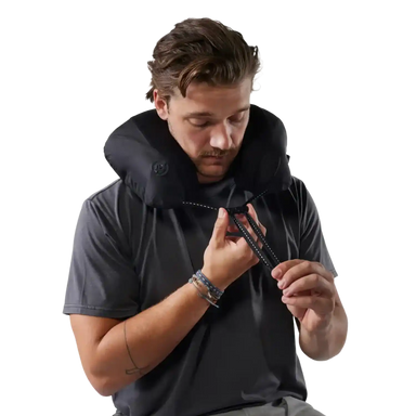 Matador Blackout Travel Pillow in Black, view of pillow on model 