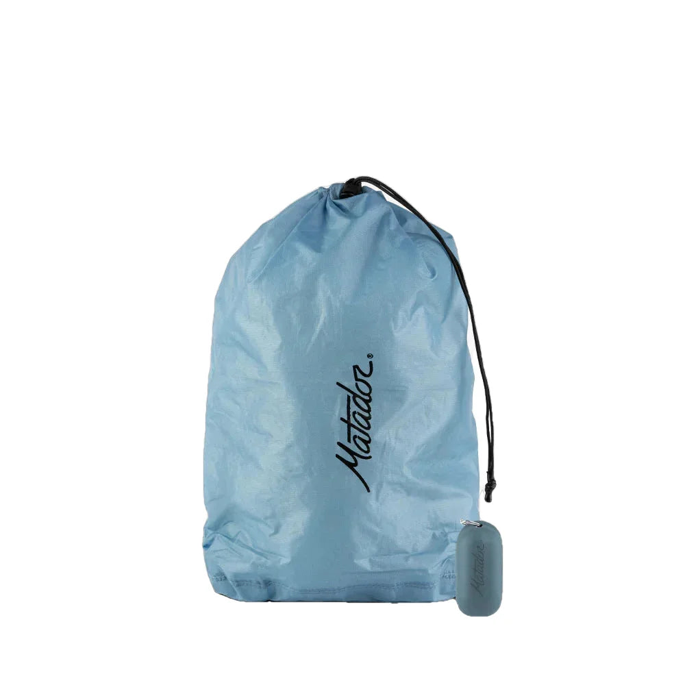 Matador Droplet Water-Resistant Stuff Sack, Blue, front view of bag stuffed