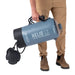 NEMO Helio™ LX Portable Pressure Shower in fortress & silt, held by model view
