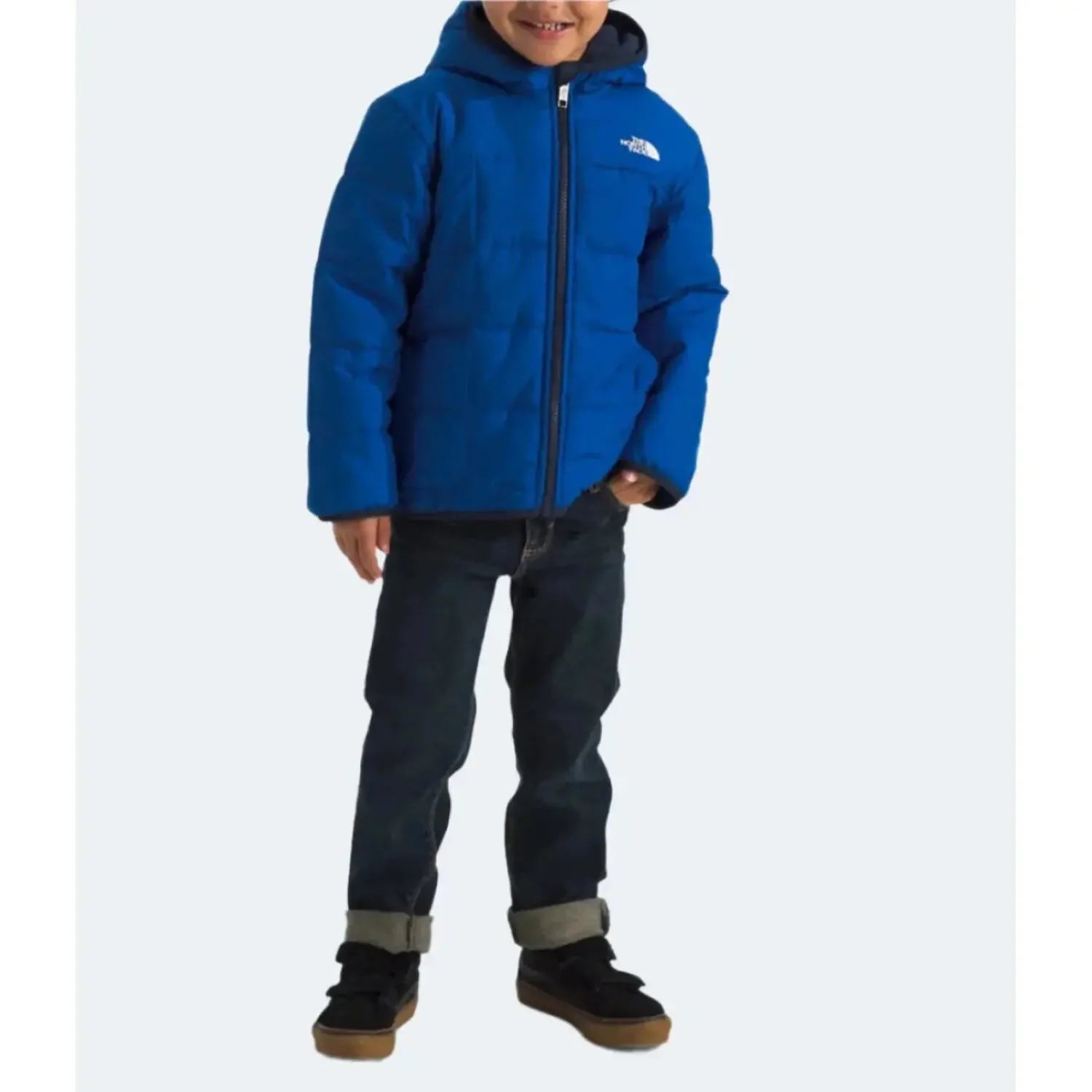 The North Face Boy’s Reversible Shasta Full-Zip Hooded Jacket shown in TNF Blue color option on a model. Front view.