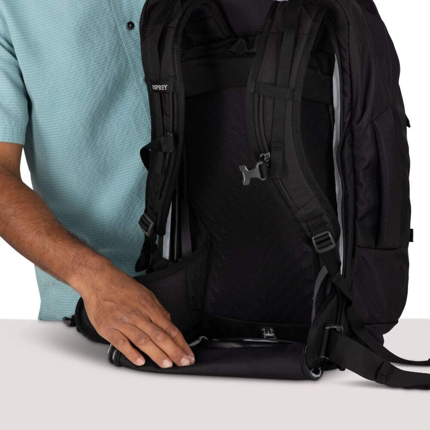 Osprey Farpoint™ 55 Travel Pack in black, back unzipped straps view