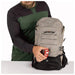 Osprey Raptor 14L Backpack with Reservoir in pediment grey, model showing front clip detail