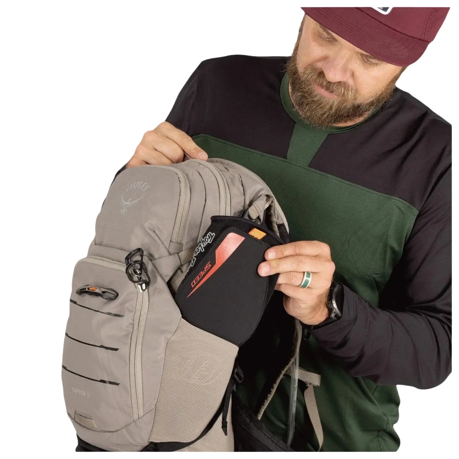 Osprey Raptor 14L Backpack with Reservoir in pediment grey, model showing side pocket detail