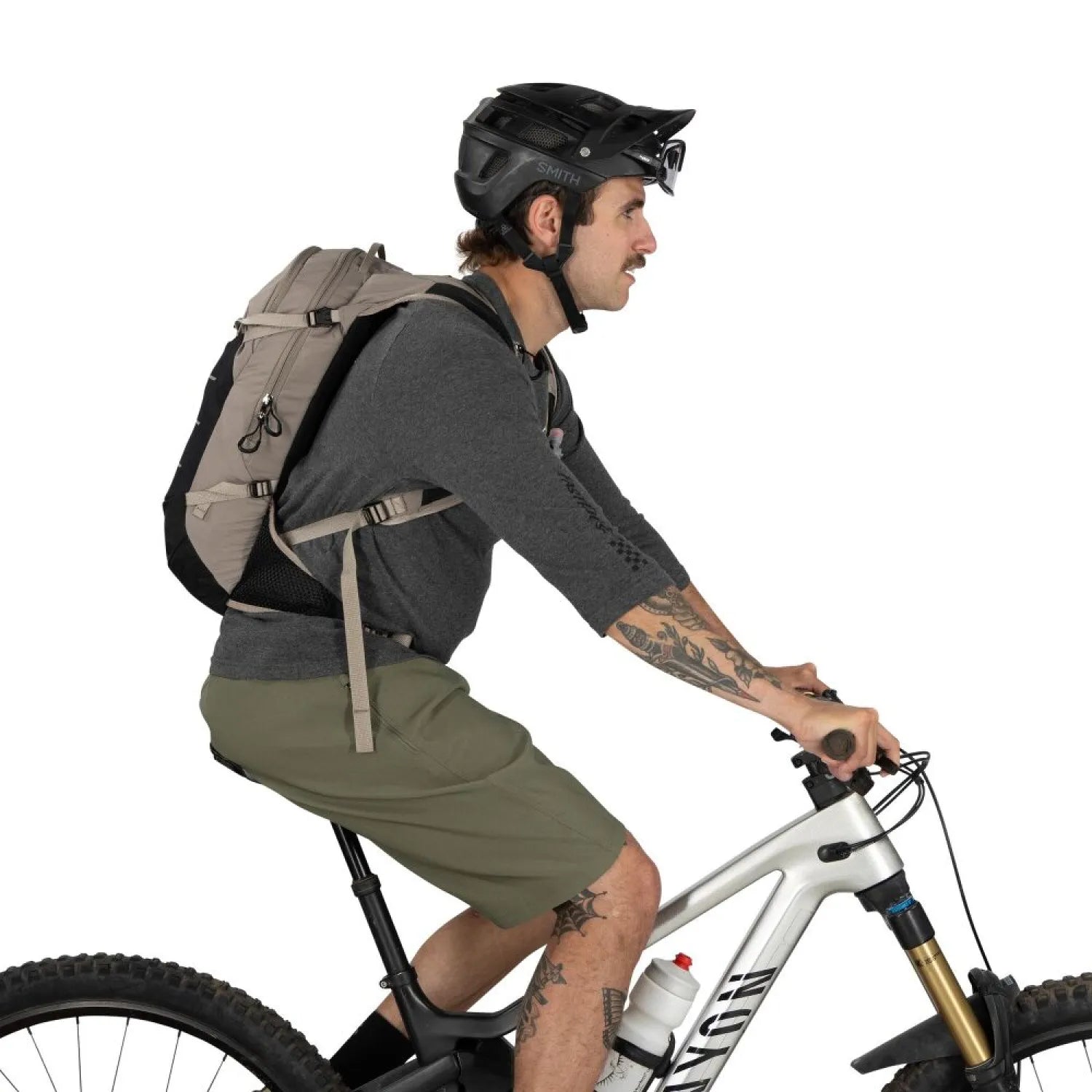 Osprey Raptor LT 12 Bike Hydration Pack in Pediment Grey Black, side view on model on bike