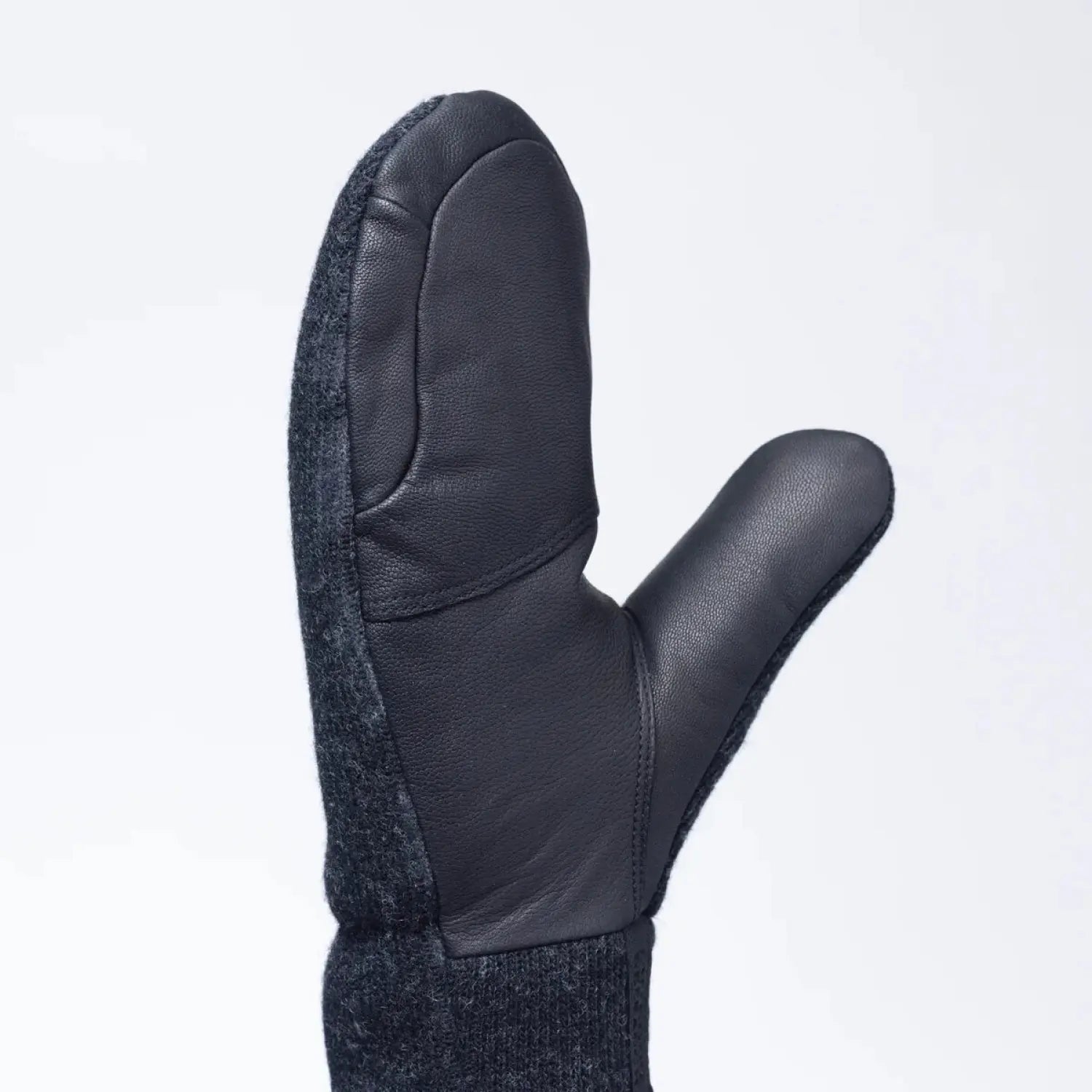 Outdoor Research Flurry Solstice Mitts shown in the Black color option. Palm view.