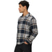 Outdoor Research Men's Feedback Flannel Twill Shirt in dark navy plaid, on model side view