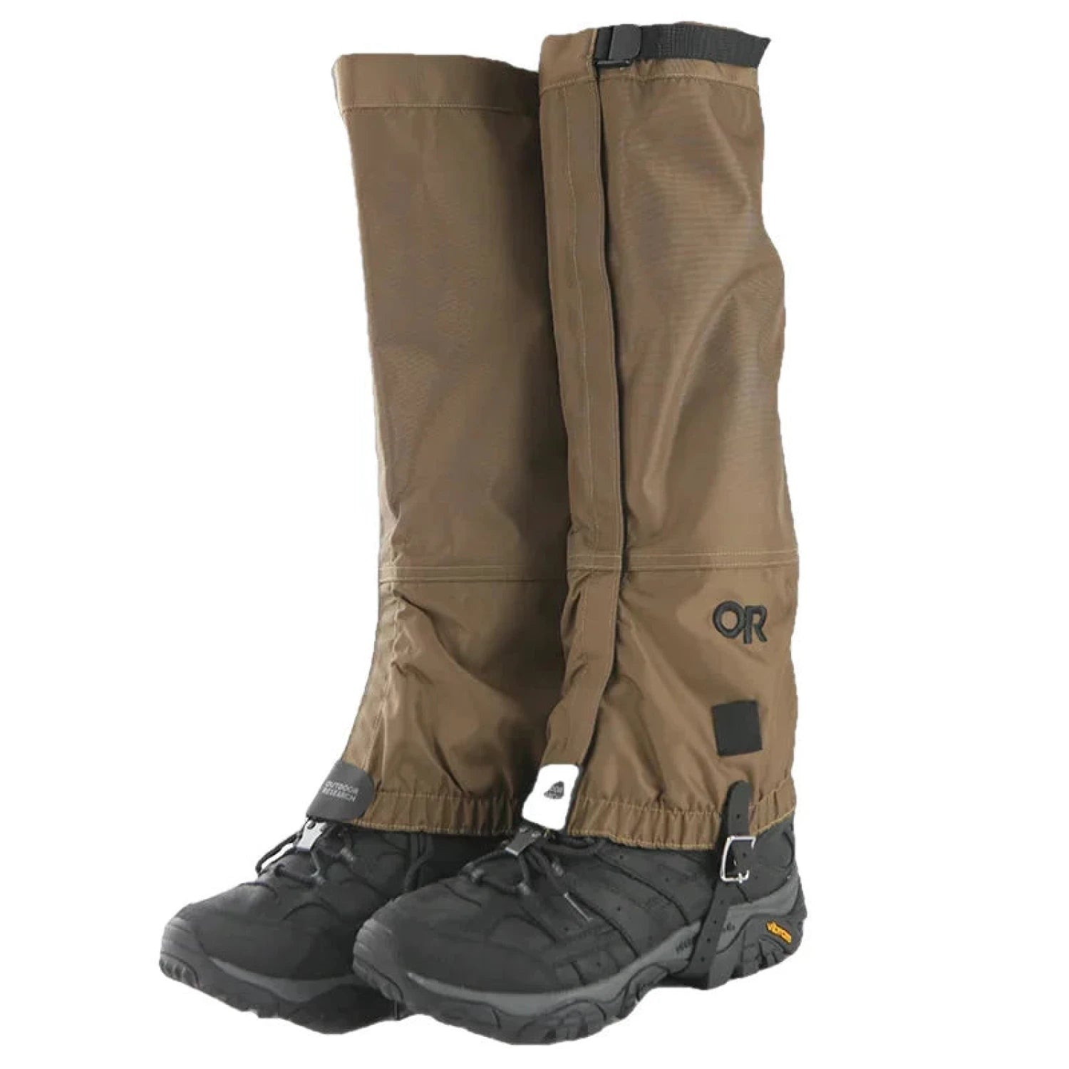 Outdoor Research Men's Rocky Mountain High Gaiters shown in Coyote a brown color,  and attached to black boots (not included in sale), with black embroidered OR logo.  