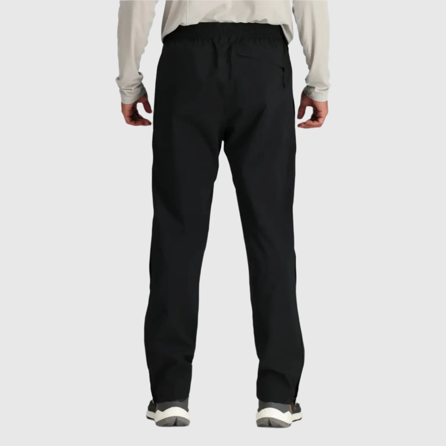 Outdoor Research Men's Stratoburst Stretch Rain Pants shown in the Black color option.  Back view on model.