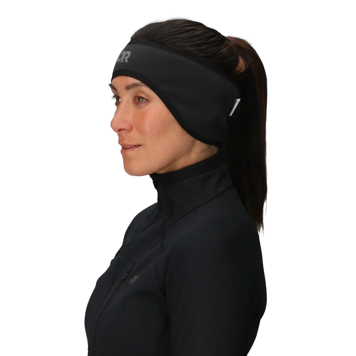 Woman wearing a black headband with a logo on a light gray background