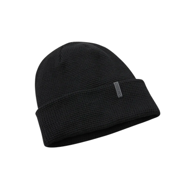 Black beanie hat on a light gray background
