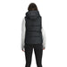 Outdoor Research Women's Coldfront Hooded Down Vest II shown in the Black color option. Back view on a model.