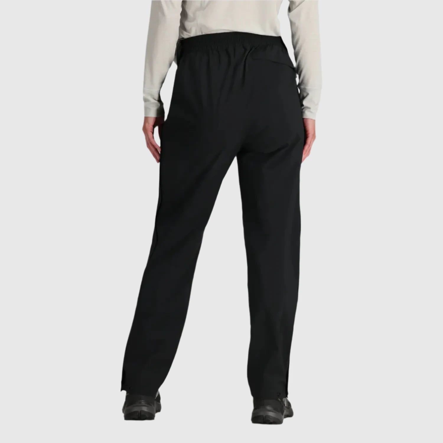 Outdoor Research Women's Stratoburst Stretch Rain Pants shown in the Black color option. Back view.