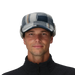 Man wearing a plaid cap with ear flaps on a gray background