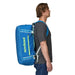 Patagonia Black Hole® Duffel Bag 55L shown in the Matte Vessel Blue color option, Backpack side view. on model