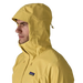 Patagonia Men's Torrentshell 3L Jacket in limestone yellow, on model hood up detail view