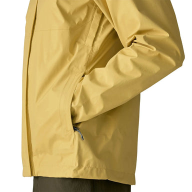 Patagonia Men's Torrentshell 3L Jacket in limestone yellow, on model pocket detail view