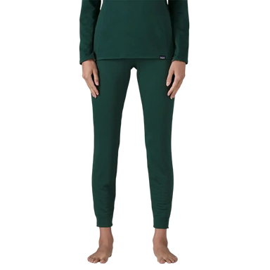 Patagonia Women's Capilene® Thermal Weight Bottoms in Cascade Green, front view on model