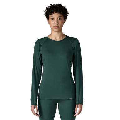 Patagonia Women's Capilene® Thermal Weight Crewneck in Cascade Green, front view on model