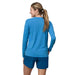 Patagonia W's Long-Sleeved Capilene® Cool Daily Graphic Shirt, Ridge Rise Moonlight: Vessel Blue X Dye, back view on model 