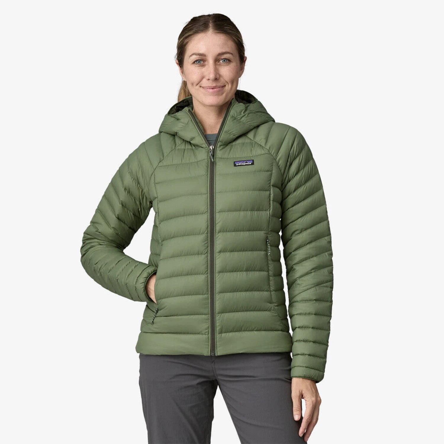 Patagonia Women's Down Sweater Hoodie shown in the Terrain Green color option. Front view on model.