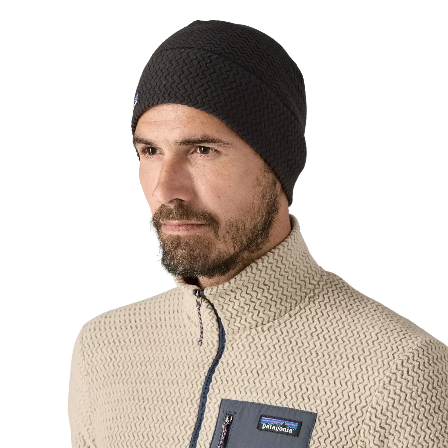 Model wearing a black Patagonia R1 Air Beanie 