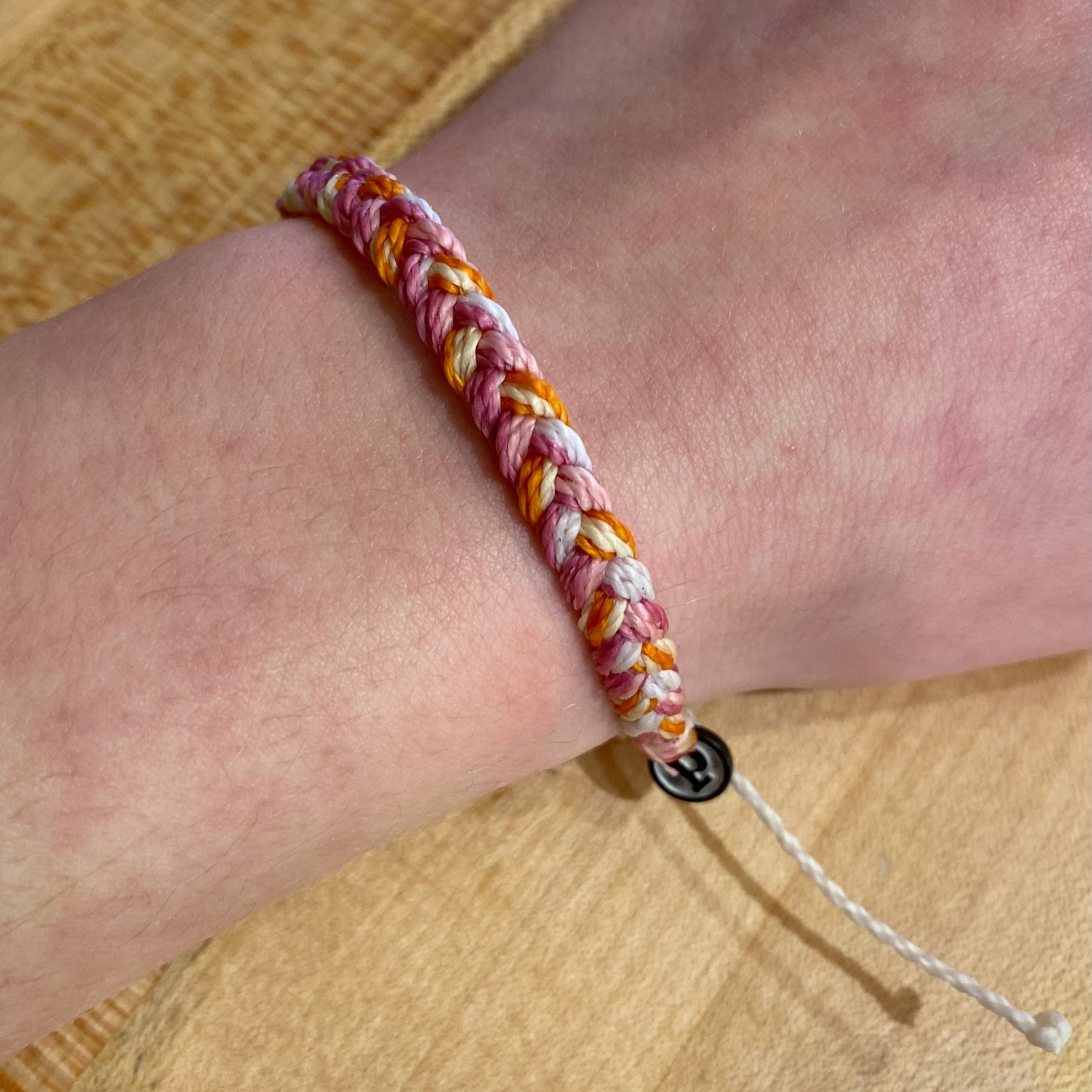 Pura Vida Multi Braided Bracelet in daiquiri, view on model 