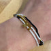 Pura Vida Stretch Bracelet Set of 3 in monochrome, gold & black, view on model 