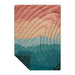 Rumpl Original Puffy Blanket in rocky mountain sunset fade, flat front