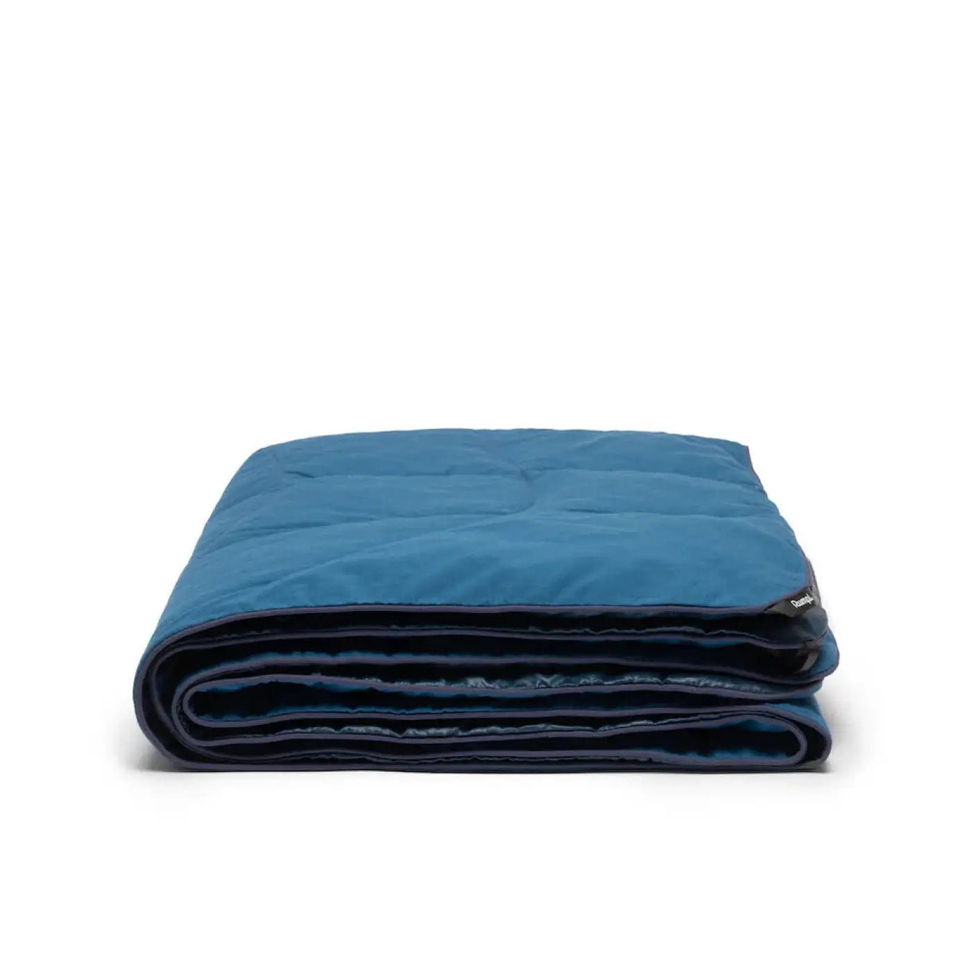 Rumpl NanoLoft® Flame Blanket shown in the Deepwater color. Folded.