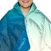 Rumpl Travel Puffy Blanket in deepfoam fade, cape clip detail