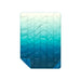 Rumpl Travel Puffy Blanket in deepfoam fade, front view