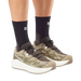 Salomon Men's Aero Glide 4 GRVL Running Shoes in safari, vanilla ice & dark earth, model view