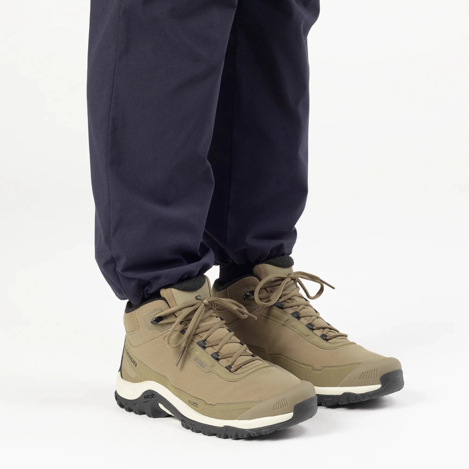 Salomon Men's SHELTER WATERPROOF Hiking Boot in stone gray & black, side view on model