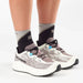 Salomon Women's Aero Glide 4 GRVL in vanilla ice, black & iron, model view