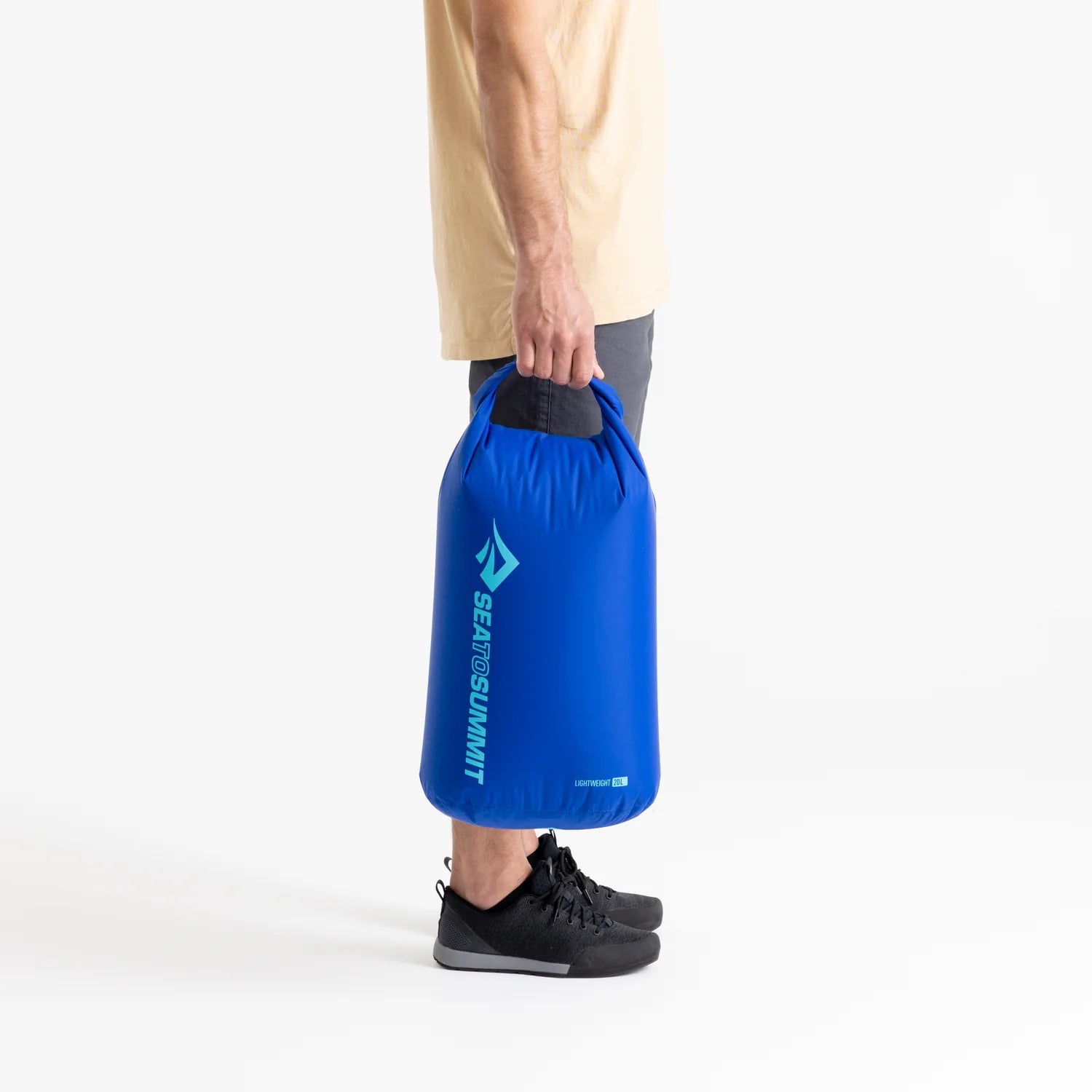 Sea To Summit Lightweight Dry Bag, model holding 20L