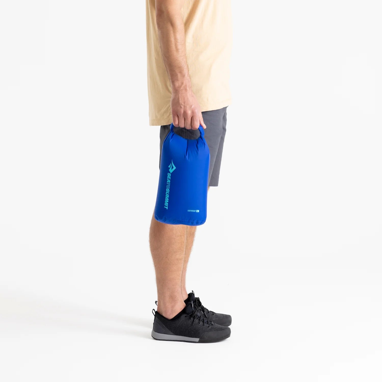 Sea To Summit Lightweight Dry Bag, model holding 5L