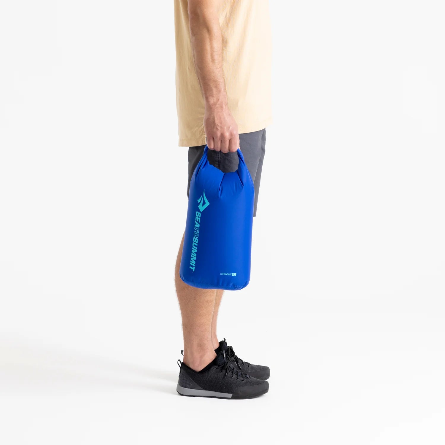 Sea To Summit Lightweight Dry Bag, model holding 8L
