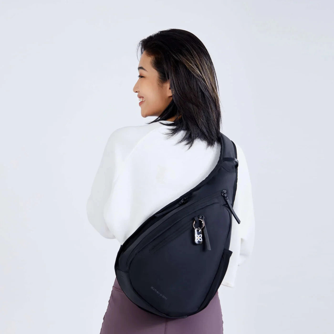 Sherpani Esprit AT Sling, Carbon, back view on model 