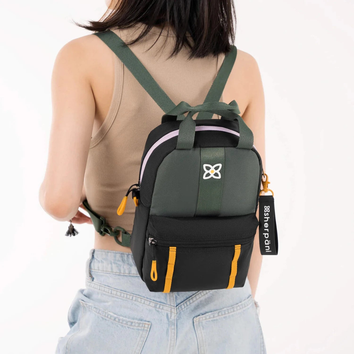 Sherpani Logan Mini Backpack, Juniper, back view on model 