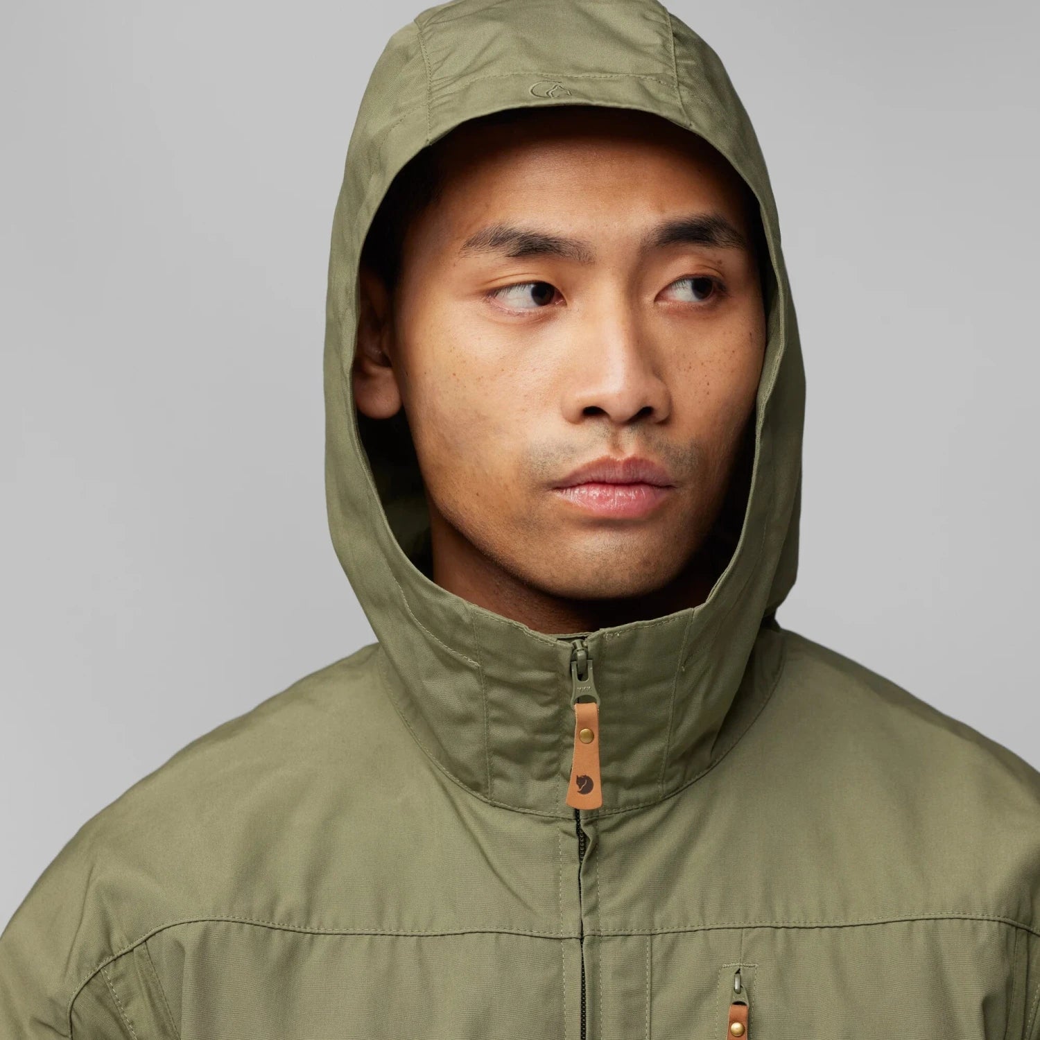 Fjall Raven Men's Sten Jacket in green, on model hood up view