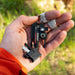 sun company outsider 4-in-1 survival multi-tool detailed in hand view