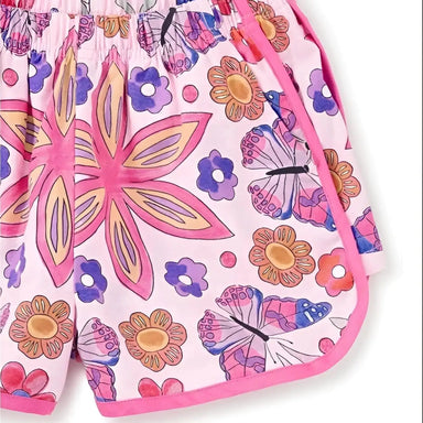 Tea Collection Girl's Woven Dolphin Shorts in butterfly tile, hem detail