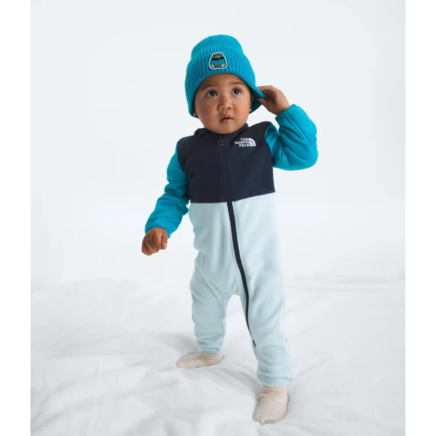The North Face Baby Glacier One-Piece in Summit Navy Meridian Blue Polar Hazel, front view on model 